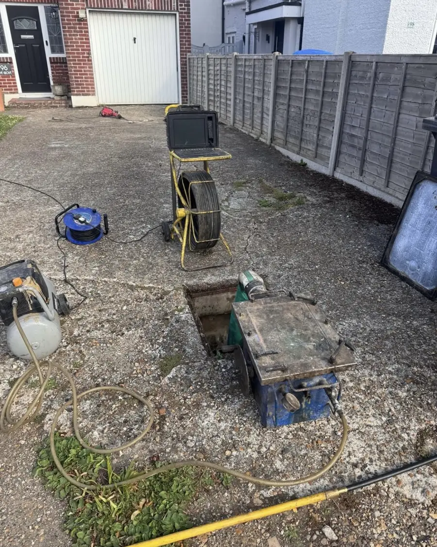 No-dig relining and patch repair equipment set up on a drainage job